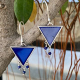 92.5 silver dangler earrings with hanging blue glass stone.