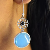 92.5 silver dangler earrings with round aqua drop stone.