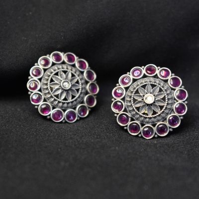 92.5 Silver studs with ruby coloured stones!