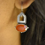 92.5 silver dangler earrings with rust coloureds stone.