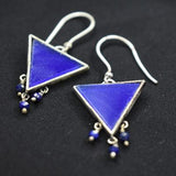 92.5 silver dangler earrings with hanging blue glass stone.